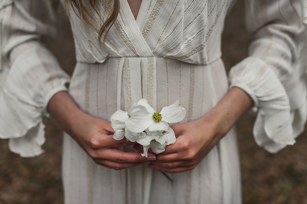 Bride and groom walking hand in hand during a Traverse City beach elopement